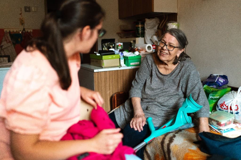 Friendly companionship and conversation supporting someone at home